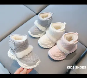 Detailed view of kids' waterproof snow boots with soft fleece lining and quilted design.