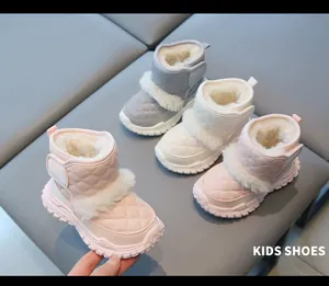 Detailed view of quilted kids' snow boots with warm faux fur lining in multiple colors