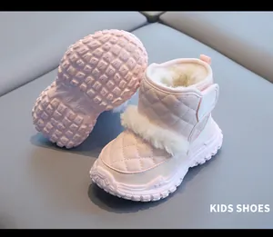 Detailed view of pink kids snow boots with plush lining and thick non-slip soles