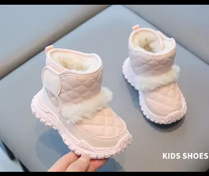Macro view of pink kids snow boots featuring warm fur lining and quilted design