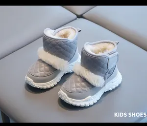 Detail of grey winter snow boots for toddlers with warm white faux fur lining.