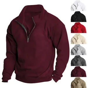 Close-up of men's half-zip burgundy fleece sweatshirt showing texture and color variants