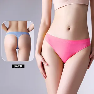 Comfortable seamless low-waist sports thong for women in solid pink with a back view