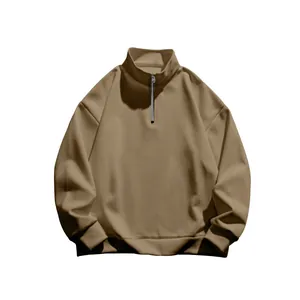 Detail of khaki men's fleece-lined sweatshirt featuring a half-zip stand collar design