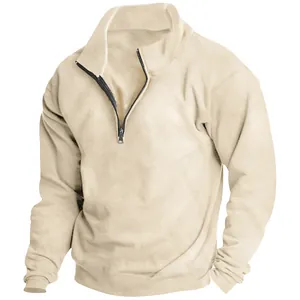 Close-up detail of beige men's half-zip sweatshirt showing collar and metal zipper.