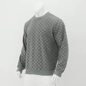 Detailed side view of grey checkerboard textured long-sleeved crewneck sweatshirt for men