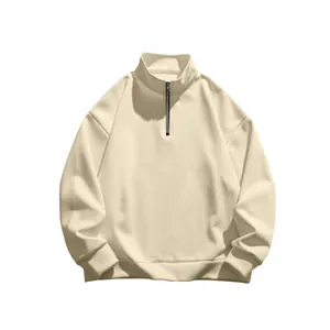 Detailed macro shot of cream men's half-zip fleece sweatshirt with stand collar.