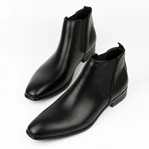 Elegant black men's Chelsea boots in British style on a clean white background