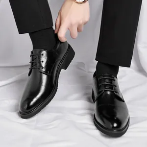 Classic black men's formal dress shoes with textured grid pattern for business and weddings
