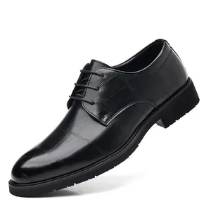 Elegant black men's business dress shoes with crocodile pattern texture and thick soles
