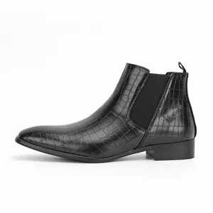 Detailed side profile of black men's Chelsea boot with stylish crocodile texture pattern.