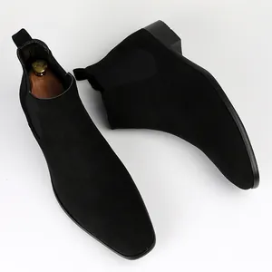 Professional view of black suede men's Chelsea boots featuring modern square toe design
