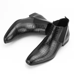 Elegant black men's Chelsea boots featuring premium luxury crocodile skin texture