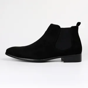 Side profile detail of men's black suede Chelsea boot with elastic side panel