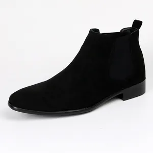 Detail shot of men's black suede Chelsea boot with square toe and elastic panel