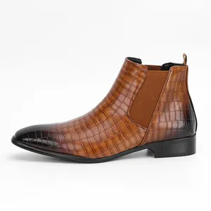 Side view of brown crocodile embossed men's Chelsea boots with a dark gradient finish.