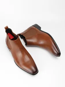 Overhead view of stylish brown leather Chelsea boots for men with square toe design