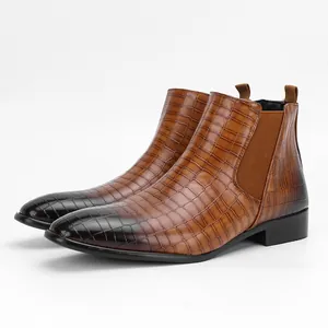 Close-up side view showing the crocodile texture on these brown men's Chelsea boots
