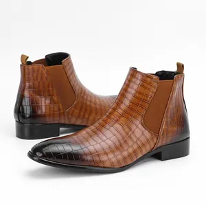 Side view of men's brown Chelsea boots with gradient crocodile texture details