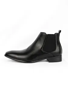 Sleek profile of black men's Chelsea boot with square toe and elastic side panel