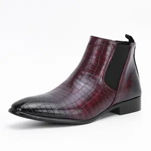 Detail of burgundy crocodile embossed Chelsea boot for men with elastic side panel