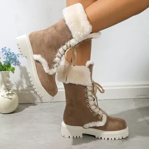 Stylish brown suede snow boots with plush white fur lining and thick rubber soles