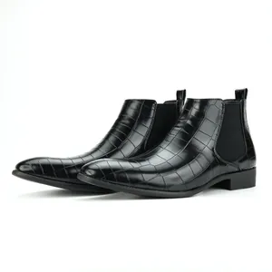 Side view of black crocodile embossed men's Chelsea boots with square toe.