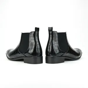 Detailed rear view of fashionable black crocodile embossed leather Chelsea boots for men