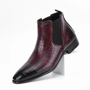 Detailed view of men's burgundy crocodile pattern Chelsea boots with a gradient finish