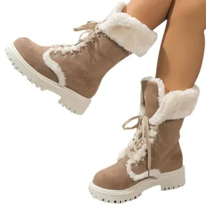 Stylish women's winter platform snow boots with cozy white faux fur lining and lace-up