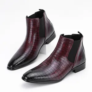 Detailed side view of wine red men's Chelsea boots featuring embossed crocodile texture