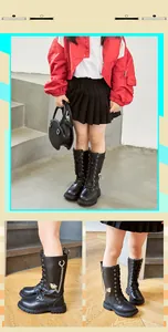 Detailansicht der stylischen schwarzen Mädchen-Langstiefel mit Kette und Herzanhänger