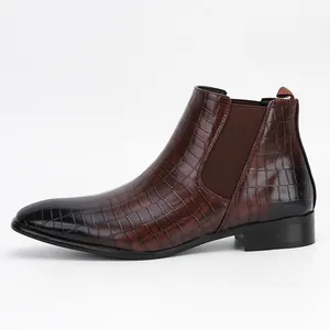 Side view of men's Chelsea boots featuring brown crocodile embossed leather texture