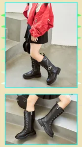 Detailansicht der schwarzen hohen Mädchenstiefel mit dekorativer Herzkette und Reißverschluss