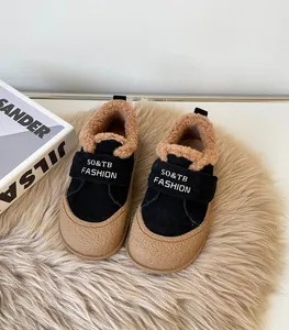 Detailed view of kids' winter sneakers with warm plush lining and Velcro straps