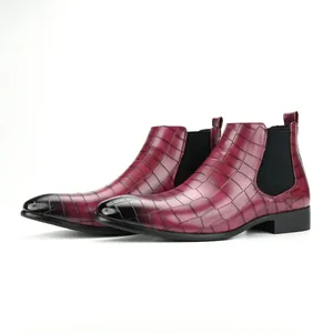 Detail view of men's burgundy crocodile pattern square toe Chelsea boots on white