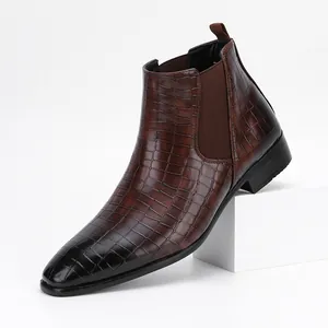 Detailed side view of premium brown crocodile pattern Chelsea boot with black burnished toe