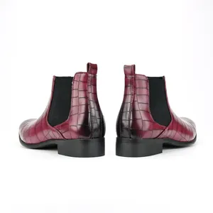 Back view of wine red crocodile embossed men's Chelsea boots with black elastic panels