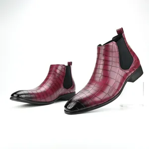 Close-up of men's burgundy croco-embossed Chelsea boots with a square toe design