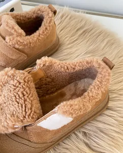 Close-up detail of warm brown fleece lining inside children's winter cotton shoes