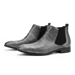 Detailed view of men's Chelsea boots featuring a unique silver fish scale pattern.