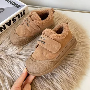 Warm brown winter fleece-lined children's shoes with velcro straps and soft soles.