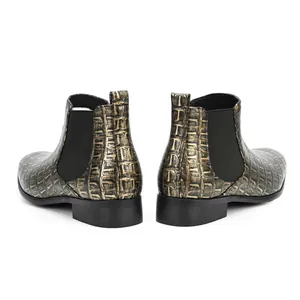Detailed rear view of men's square-toe Chelsea boots with unique golden crocodile skin texture