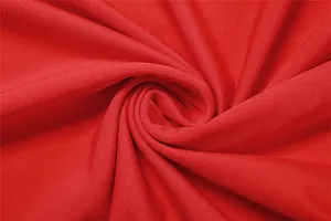 Vista detallada de la textura de tela de punto elástica rojo brillante con tejido