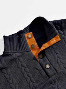 Close-up of textured jacquard sweatshirt with ribbed stand collar and orange lining