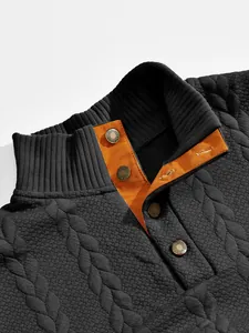 Detailed view of heavy jacquard sweatshirt collar with orange button placket lining