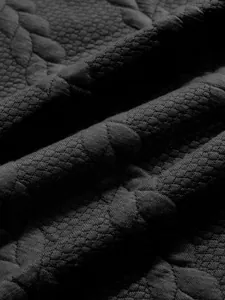 Close-up macro of heavy jacquard fabric texture for men's winter sweatshirt detail.