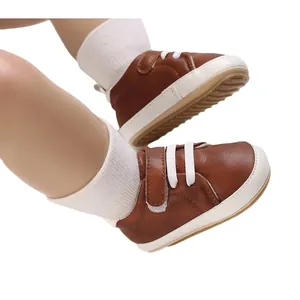 Brown faux leather baby sneakers with white laces for 0-1 year old infants