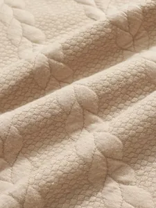 Detailed close-up showing the heavy jacquard texture of a men's autumn Henley shirt