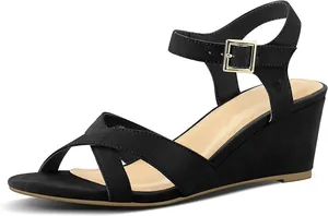 Side view of black suede wedge sandals with adjustable ankle strap and gold buckle